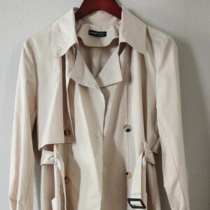 This is a SHEIN light beige belted trench coat.